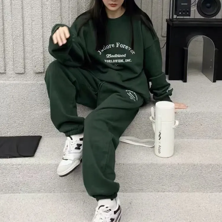 Women's cotton green American-style long-sleeved casual sportswear suit with trousers on a model