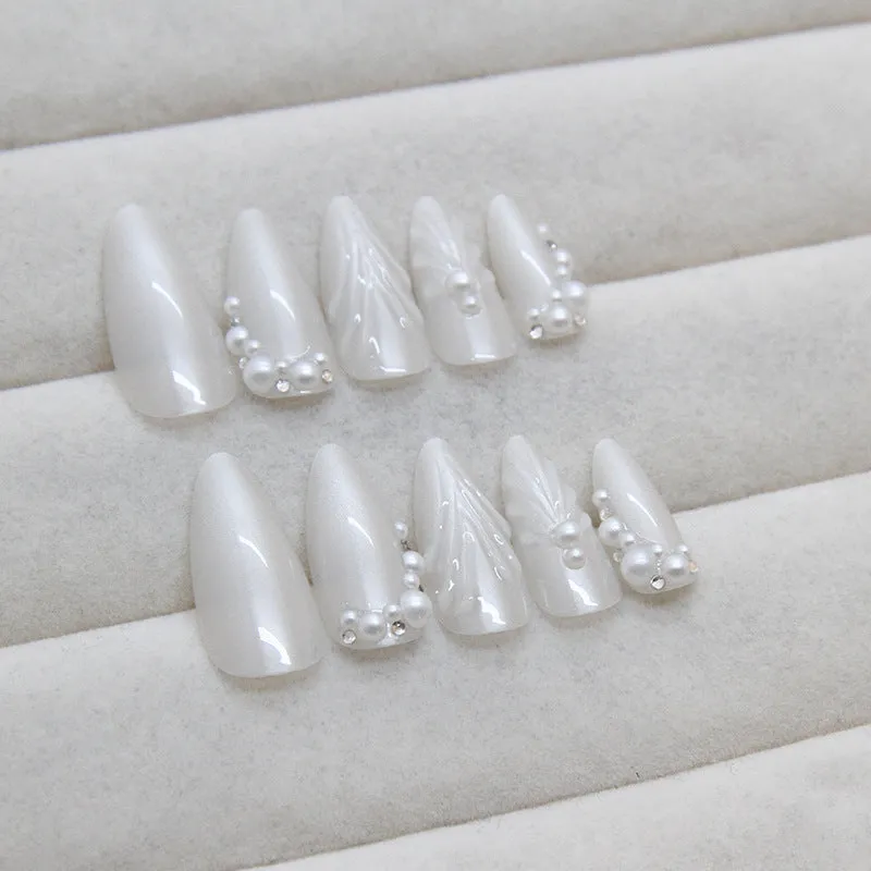 24 pieces of white press-on artificial nail tips with diamond sparkle finish in a pack