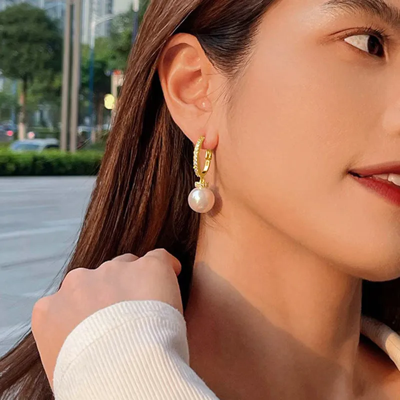 Yellow gold copper earrings with imitation pearl and inlaid zircon in geometric round shape