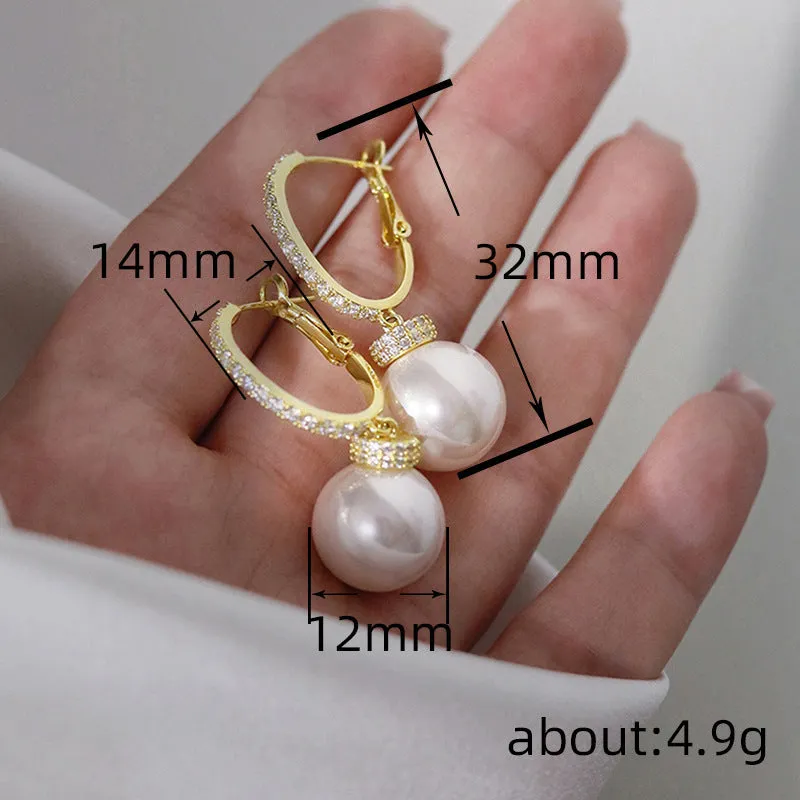 Yellow gold copper earrings with imitation pearl and inlaid zircon in geometric round shape