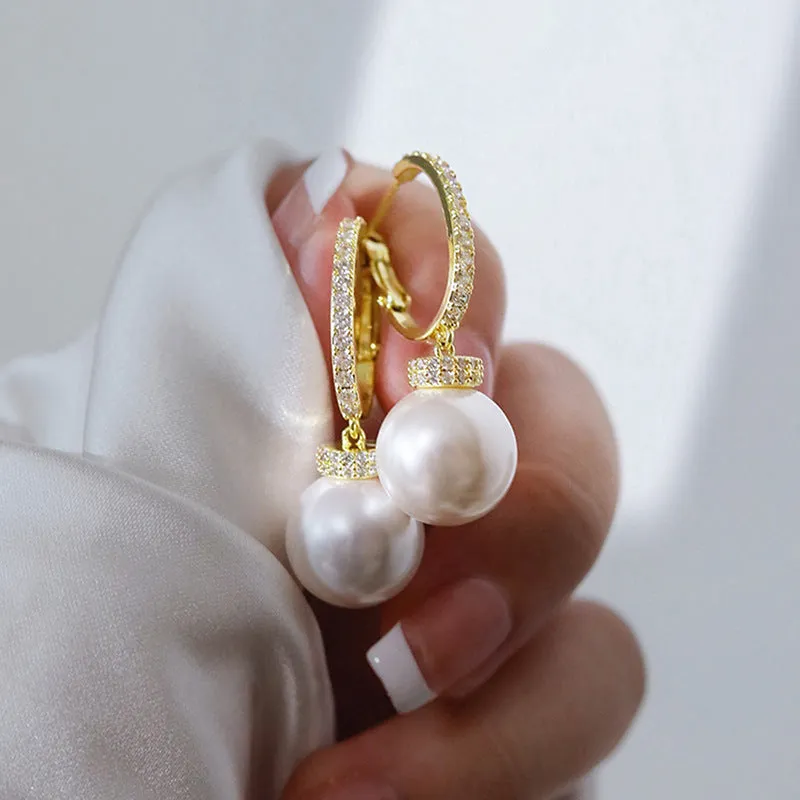 Yellow gold copper earrings with imitation pearl and inlaid zircon in geometric round shape