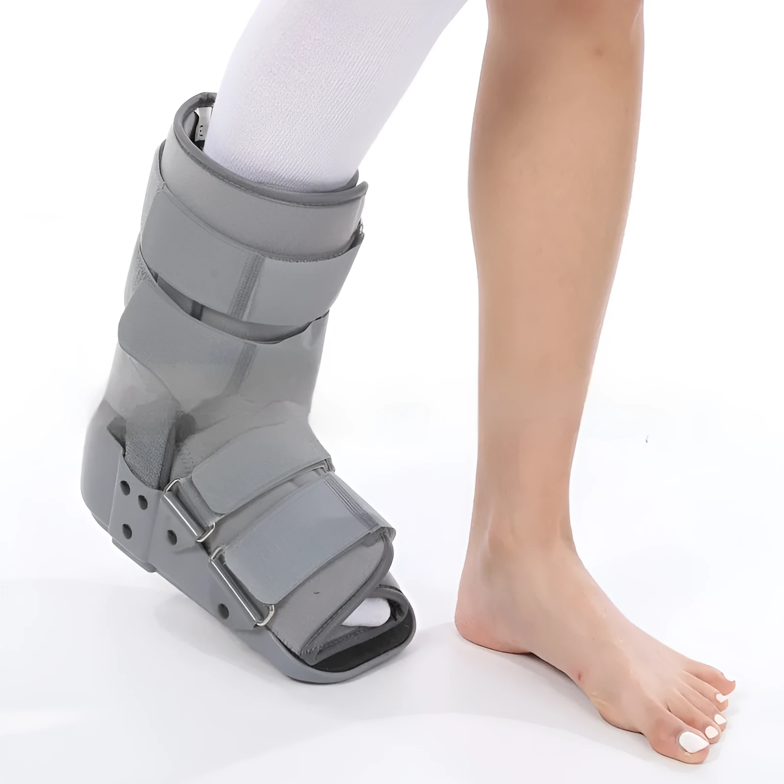 Grey and black Achilles tendon rehabilitation boot with adjustable straps and a rigid plastic shell