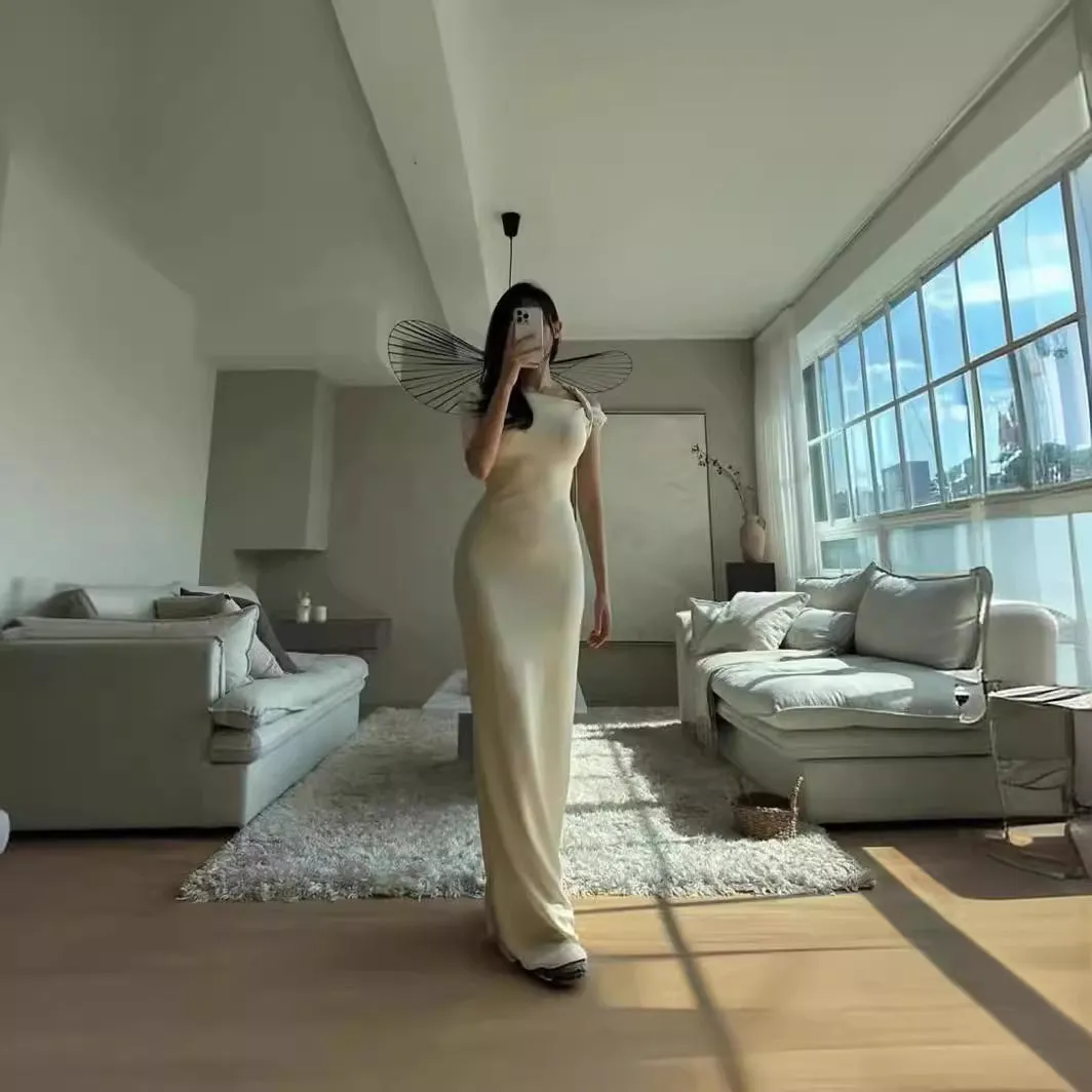 Sloping shoulder women's white long dress with high waist and hip skirt shape, sleeveless design, fold detail