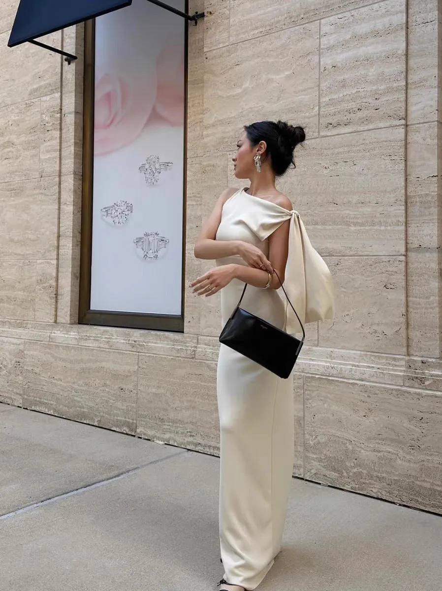Sloping shoulder women's white long dress with high waist and hip skirt shape, sleeveless design, fold detail