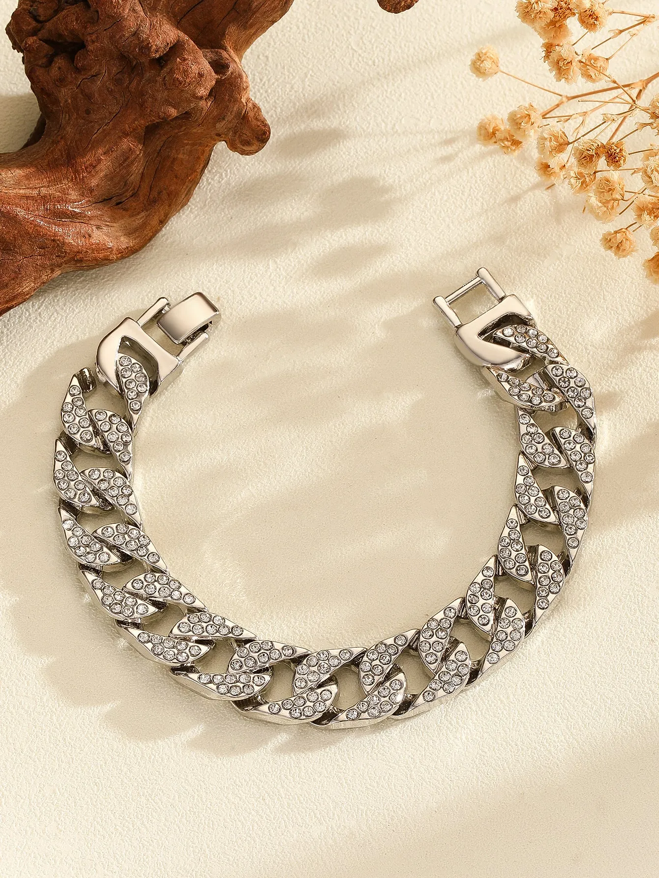 Full diamond heavy metal rap bracelet in gold with chunky link construction and diamond cut surface.