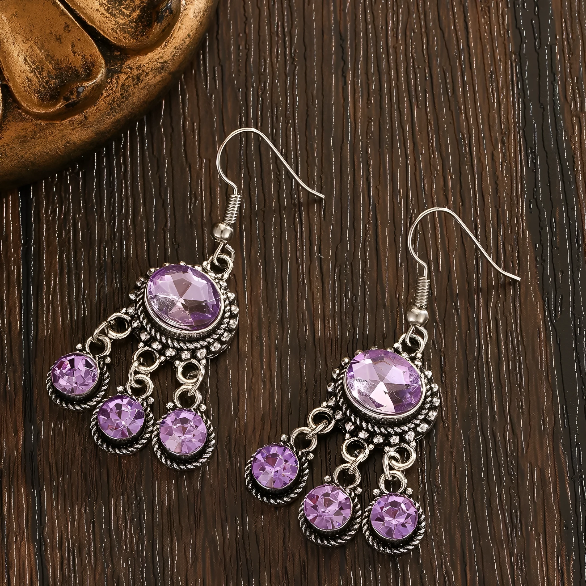 Long tassel alloy earrings in Dark Violet colour with hook fitting, hanging against a light background