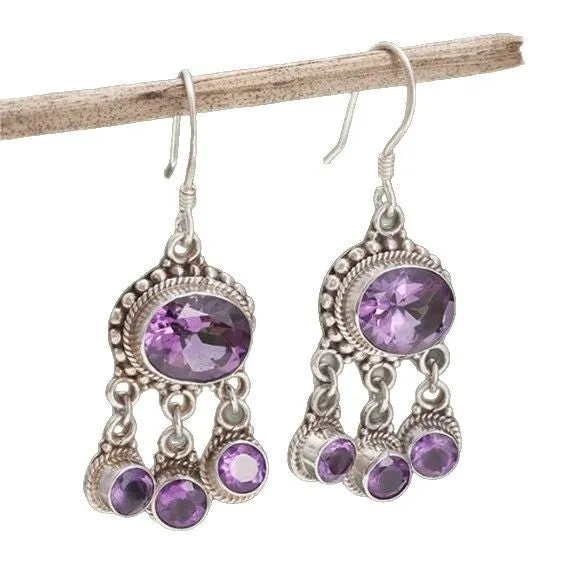 Long tassel alloy earrings in Dark Violet colour with hook fitting, hanging against a light background