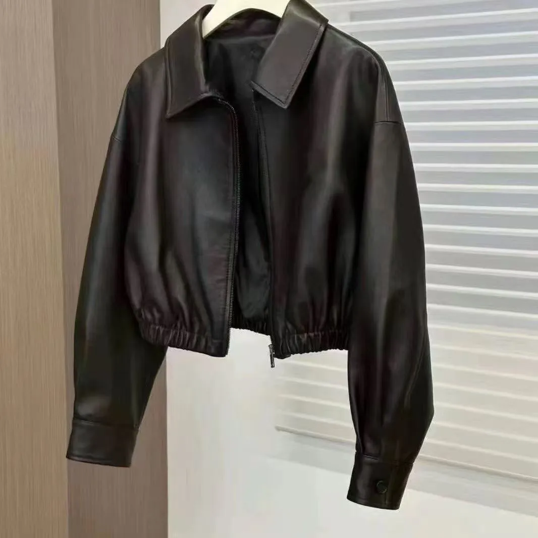 Women's black faux leather square-neck zip jacket with princess sleeves and washed finish on a model