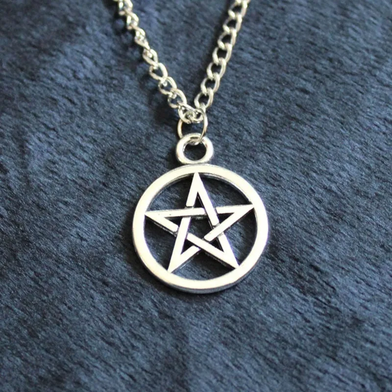 Vintage pentagram necklace with alloy pendant and adjustable chain in bronze colour on neutral background