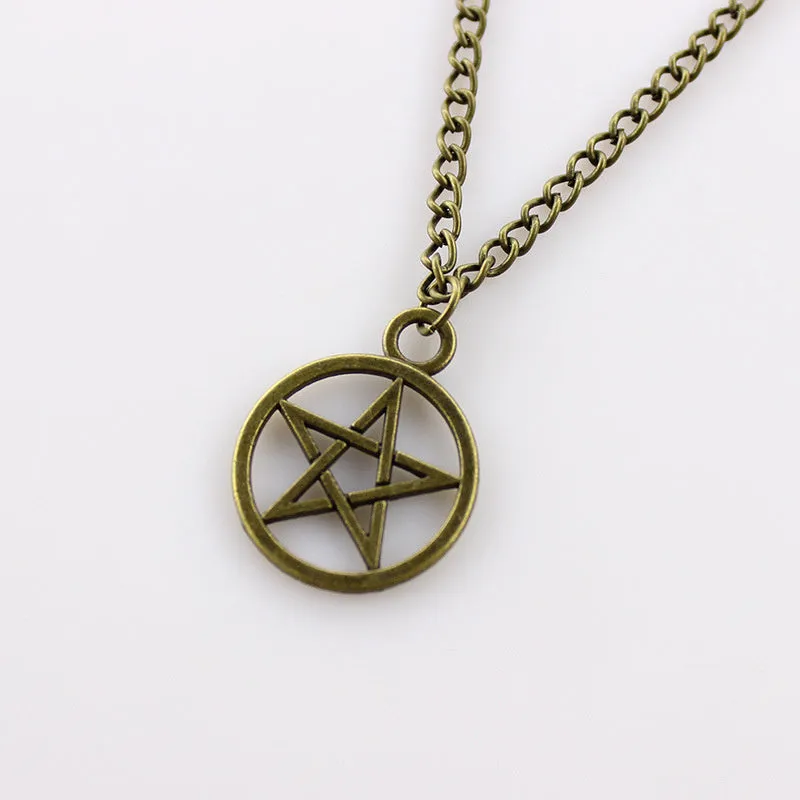 Vintage pentagram necklace with alloy pendant and adjustable chain in bronze colour on neutral background
