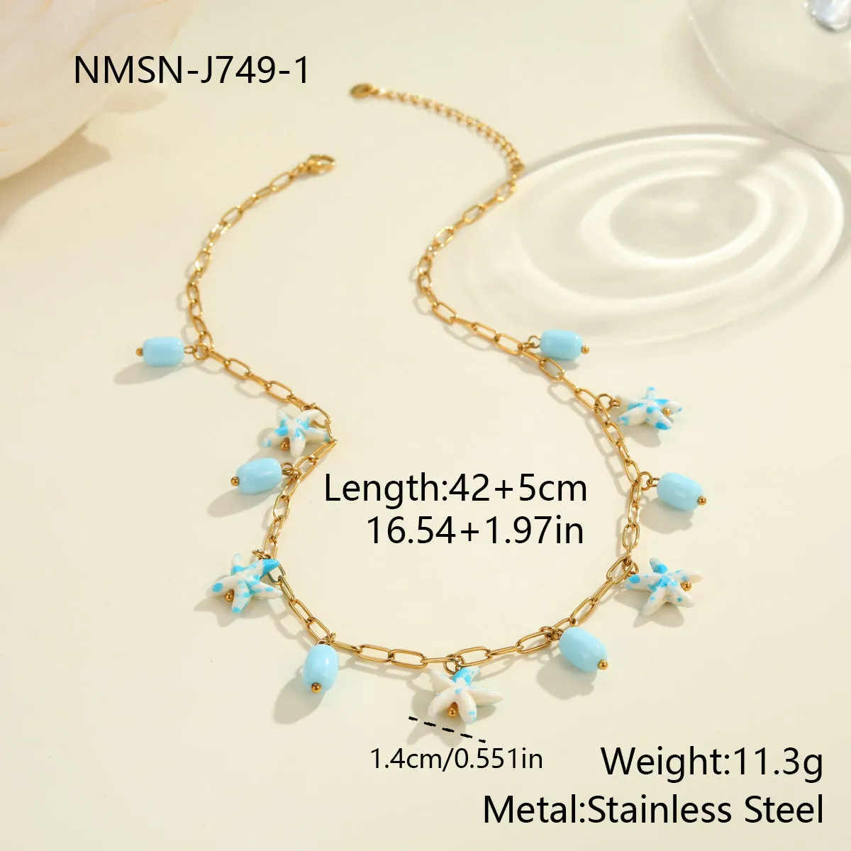 Colourful starfish stainless steel necklace and bracelet set on display, blue colour option with electroplated finish