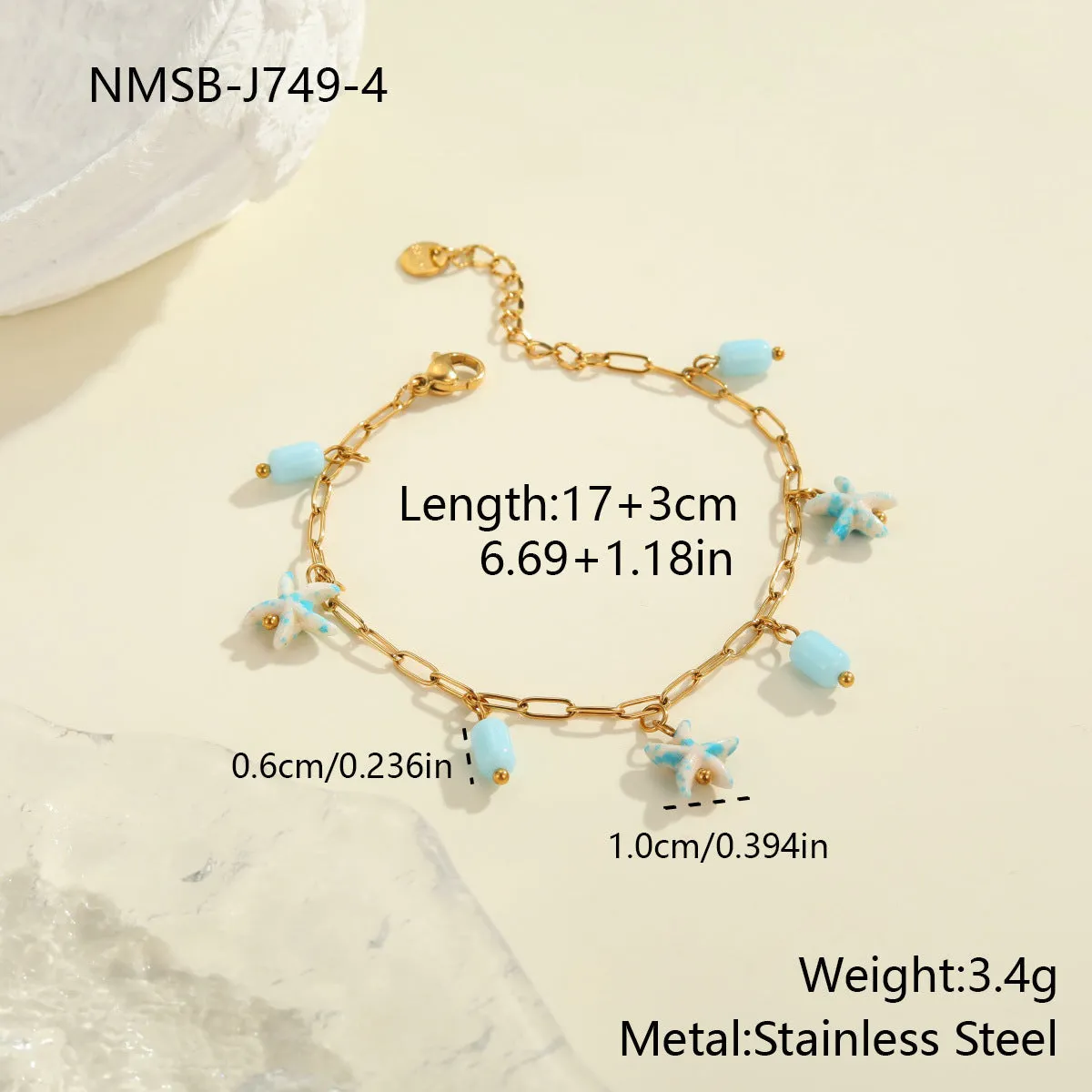 Colourful starfish stainless steel necklace and bracelet set on display, blue colour option with electroplated finish