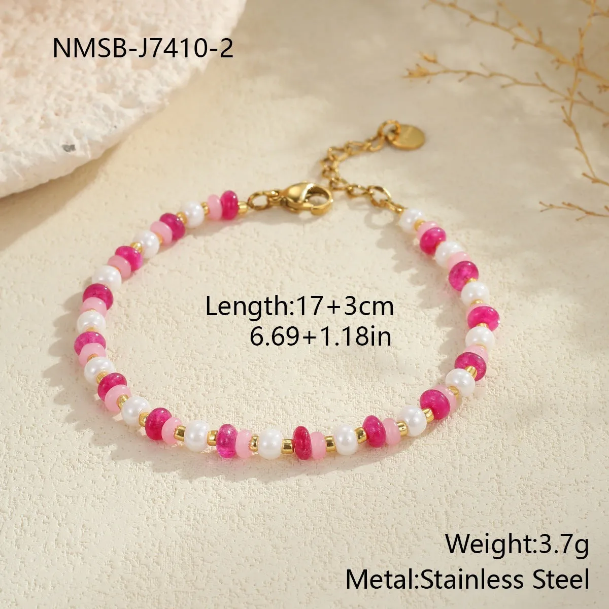 Sweet resin beaded necklace with geometric 18K stainless steel pendant, pink beads, and regular chain on light background