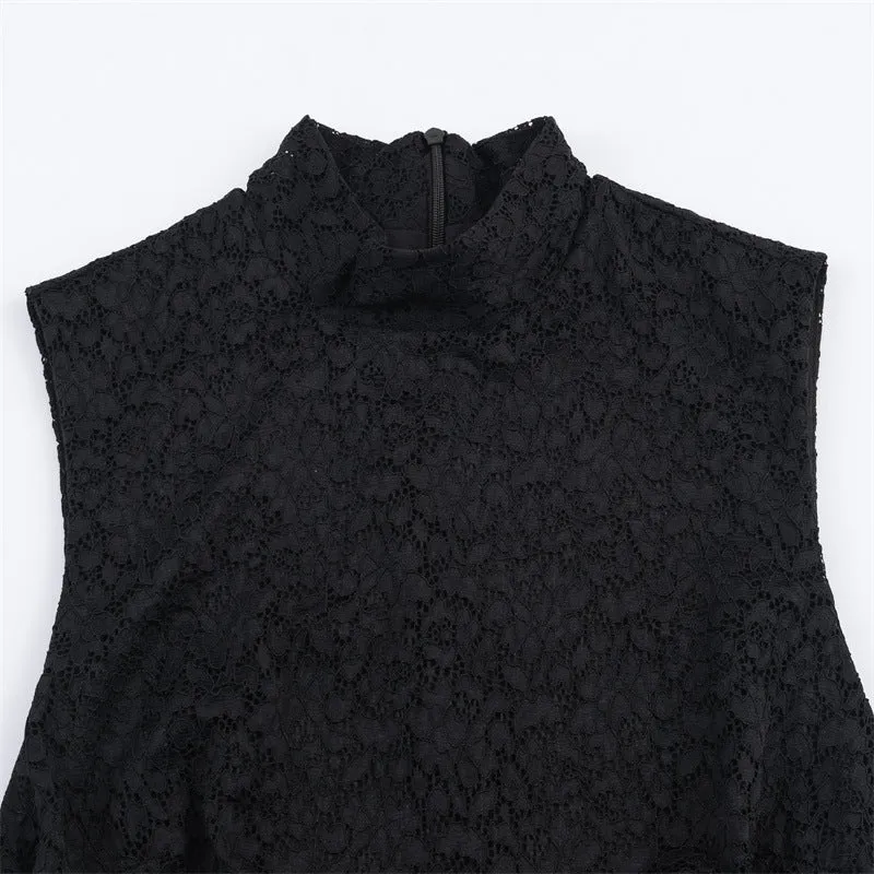 Women's black cotton short dress with lace stitching and asymmetric skirt on a plain background