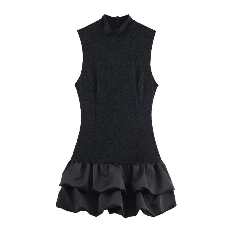 Women's black cotton short dress with lace stitching and asymmetric skirt on a plain background