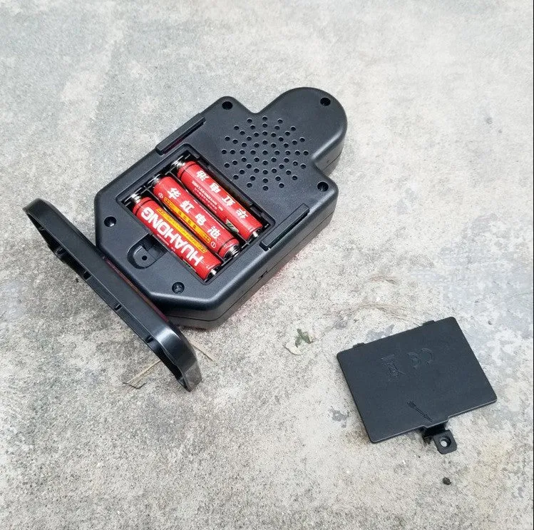 Plastic laser target with light and sound effects, dimensions 9 by 4.7 by 12.8 cm