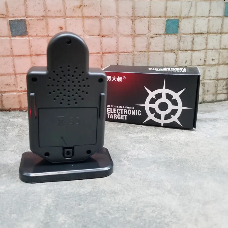 Plastic laser target with light and sound effects, dimensions 9 by 4.7 by 12.8 cm