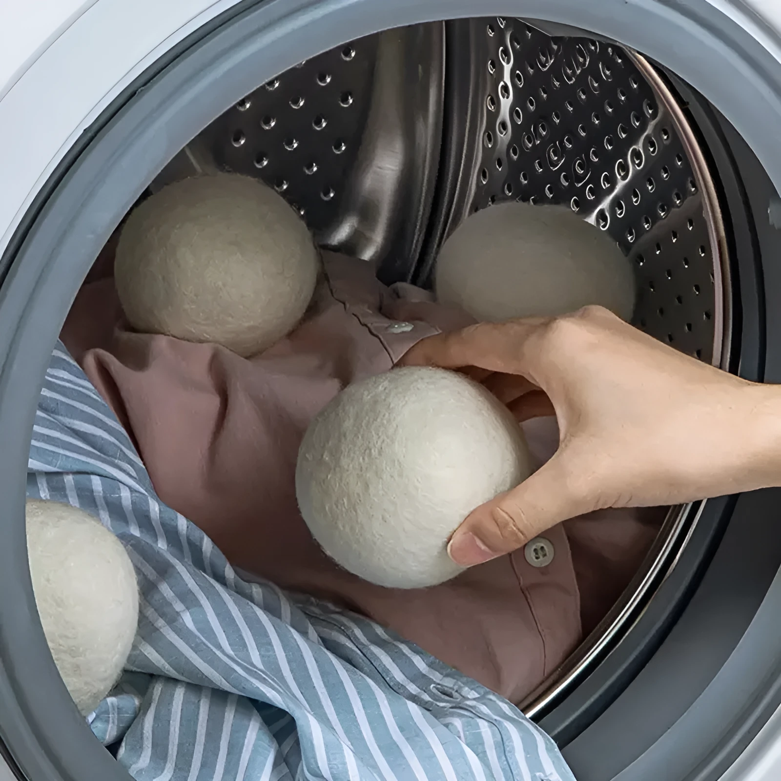 Set of six wool drying balls in three sizes 5cm 7cm 8cm for static reduction and chemical-free fabric softening