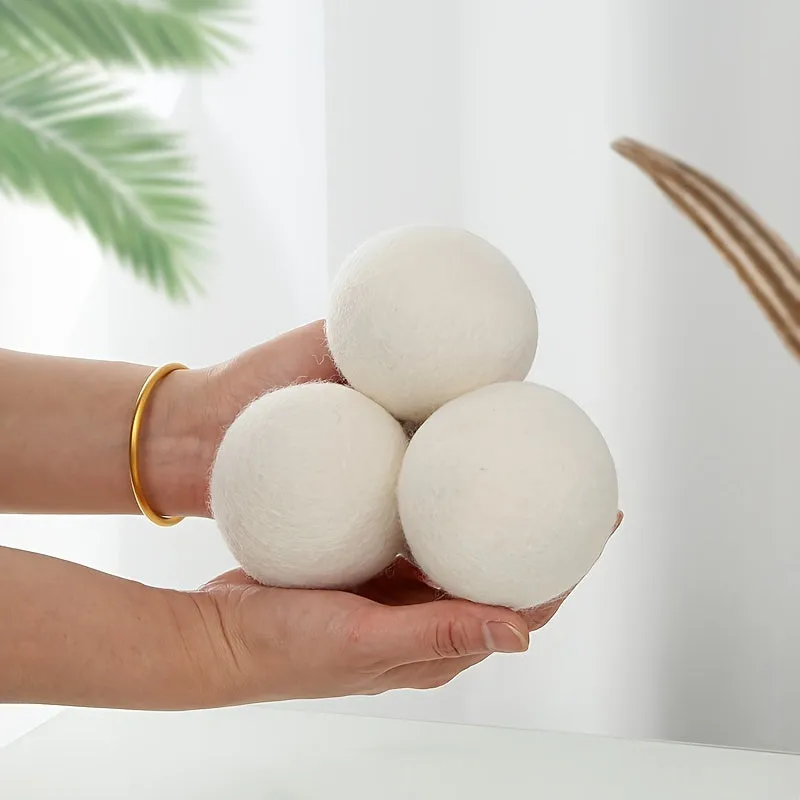 Set of six wool drying balls in three sizes 5cm 7cm 8cm for static reduction and chemical-free fabric softening