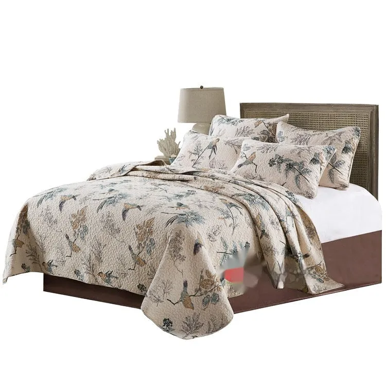 Quilted pure cotton bed cover set with printed pattern on bed, includes two pillowcases.