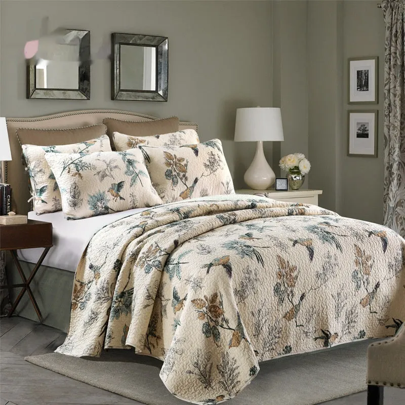 Quilted pure cotton bed cover set with printed pattern on bed, includes two pillowcases.