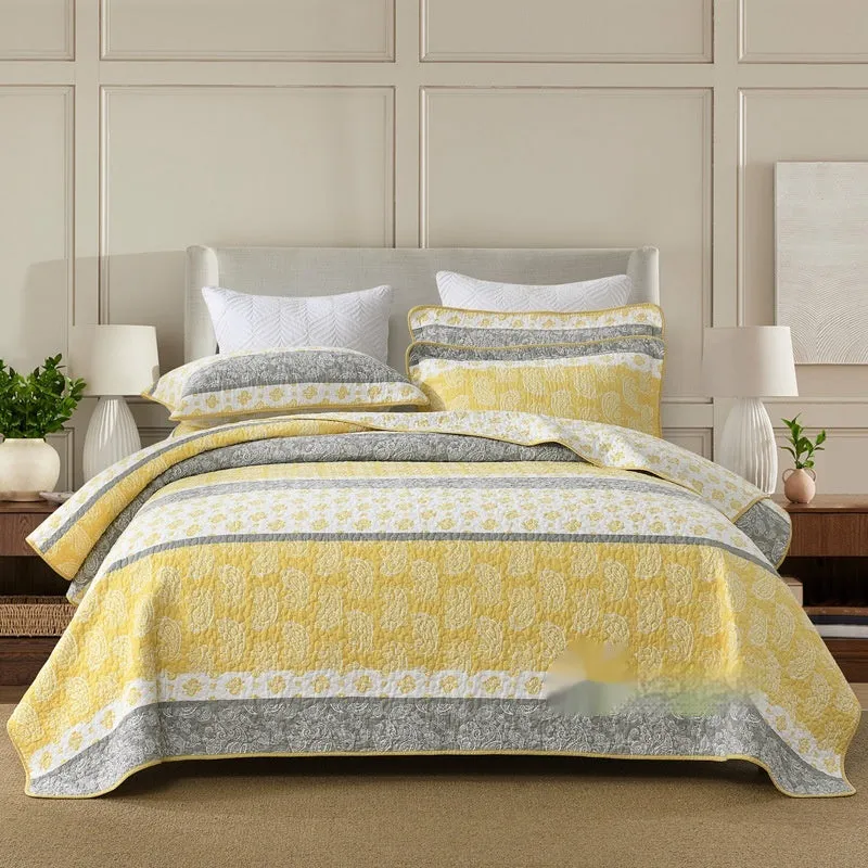 Quilted pure cotton bed cover set with printed pattern on bed, includes two pillowcases.