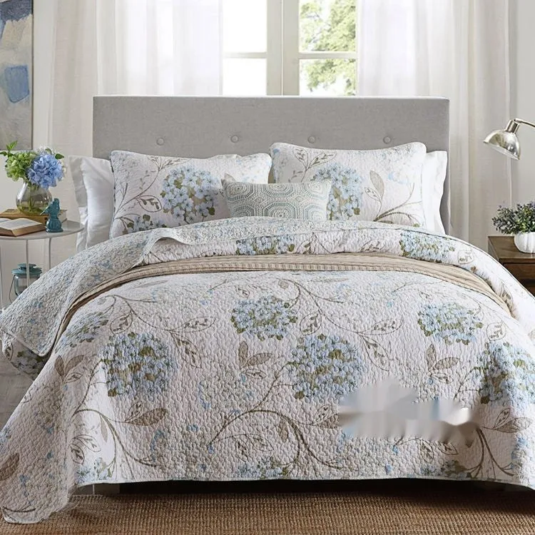 Quilted pure cotton bed cover set with printed pattern on bed, includes two pillowcases.