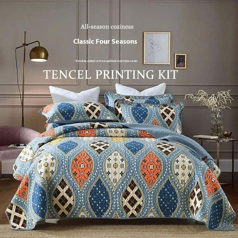 Quilted pure cotton bed cover set with printed pattern on bed, includes two pillowcases.