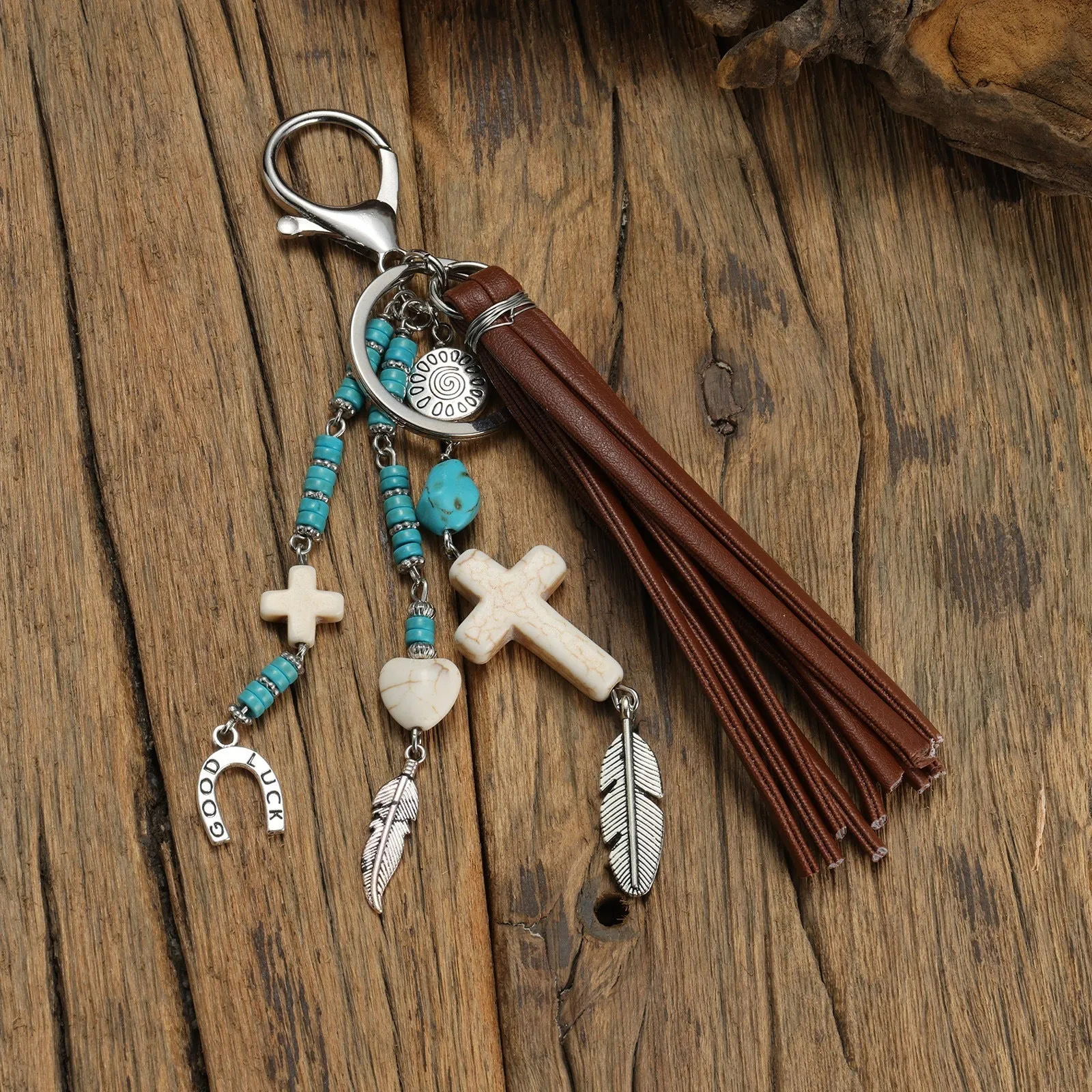 Cross alloy leather tassel pendant keychain in retro style, colour XY-3669, on a neutral background