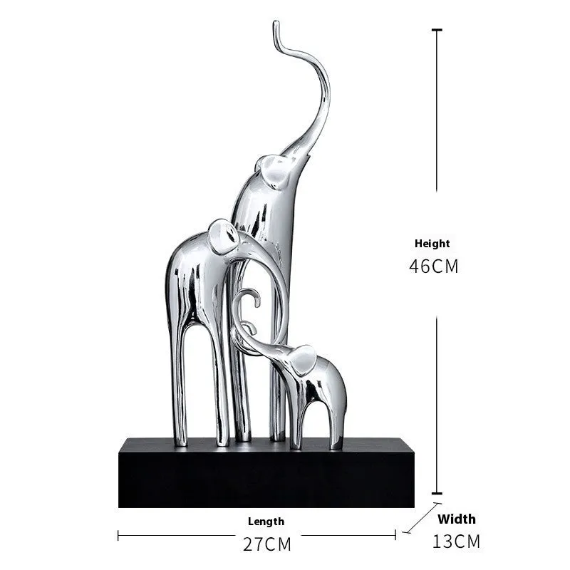Fortune Bring Elephant decorative resin statue in gold on a wooden shelf.