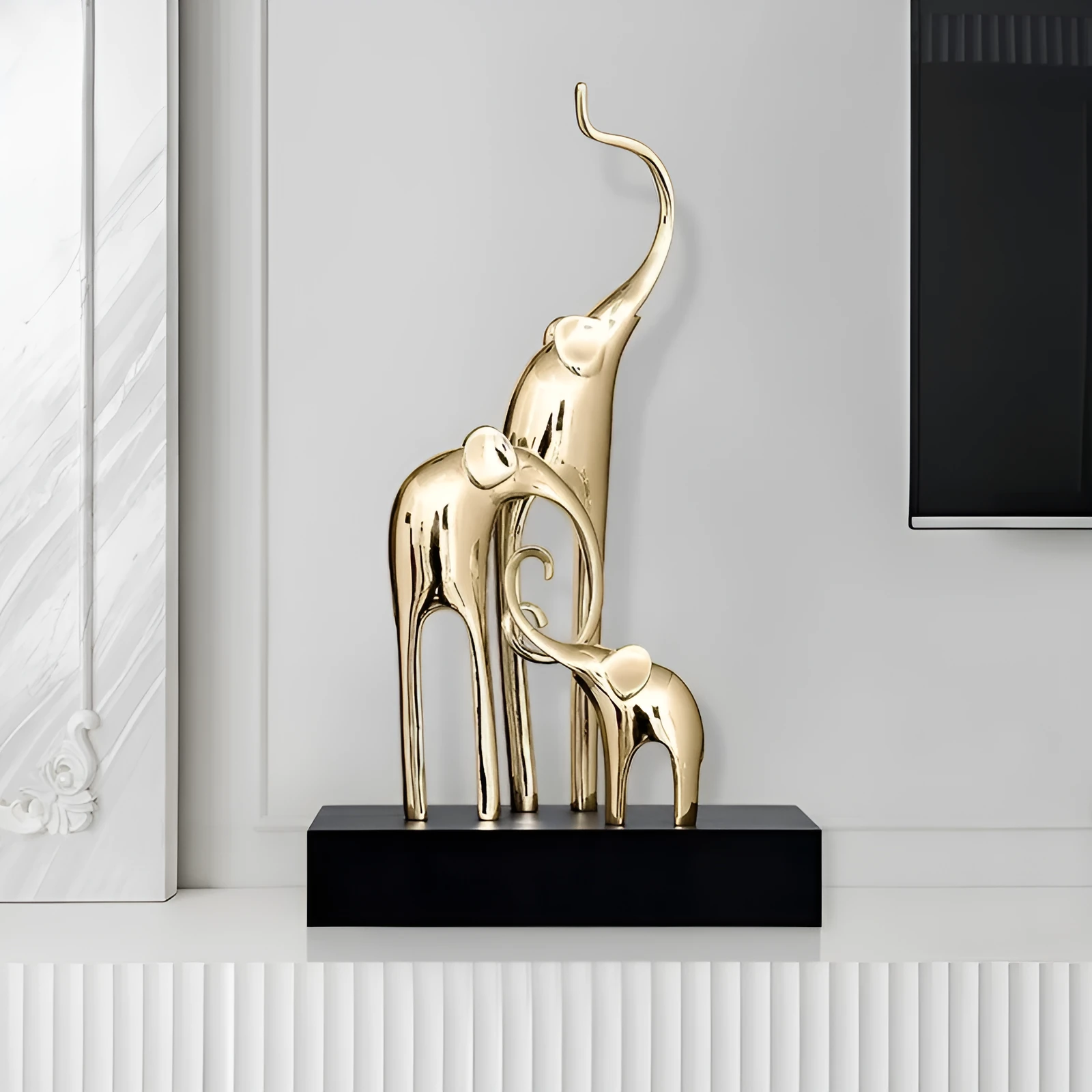 Fortune Bring Elephant decorative resin statue in gold on a wooden shelf.