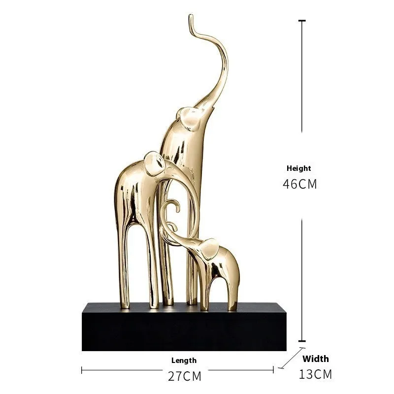 Fortune Bring Elephant decorative resin statue in gold on a wooden shelf.