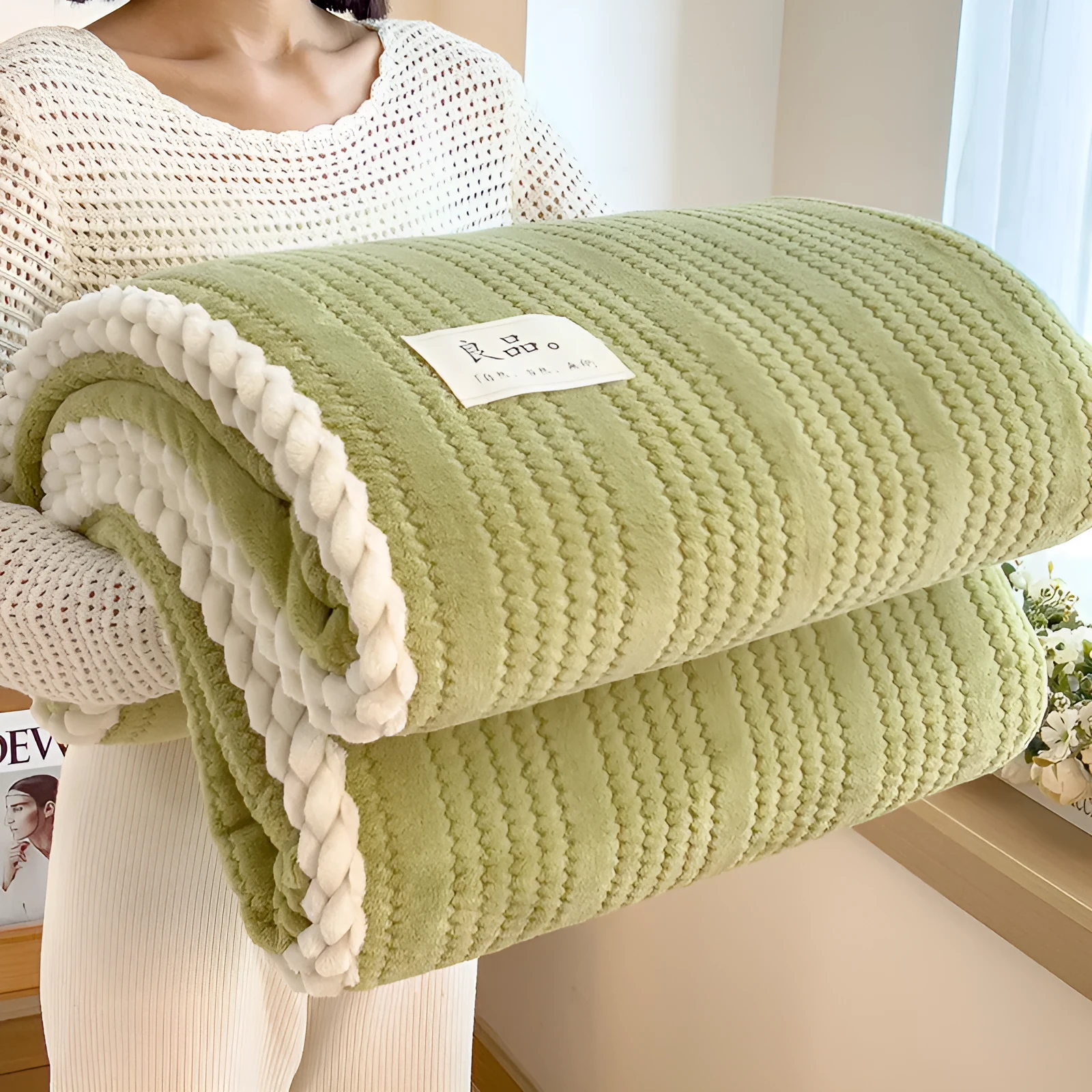 Solid colour jacquard milk velvet blanket in green on a bed with Nordic style decor