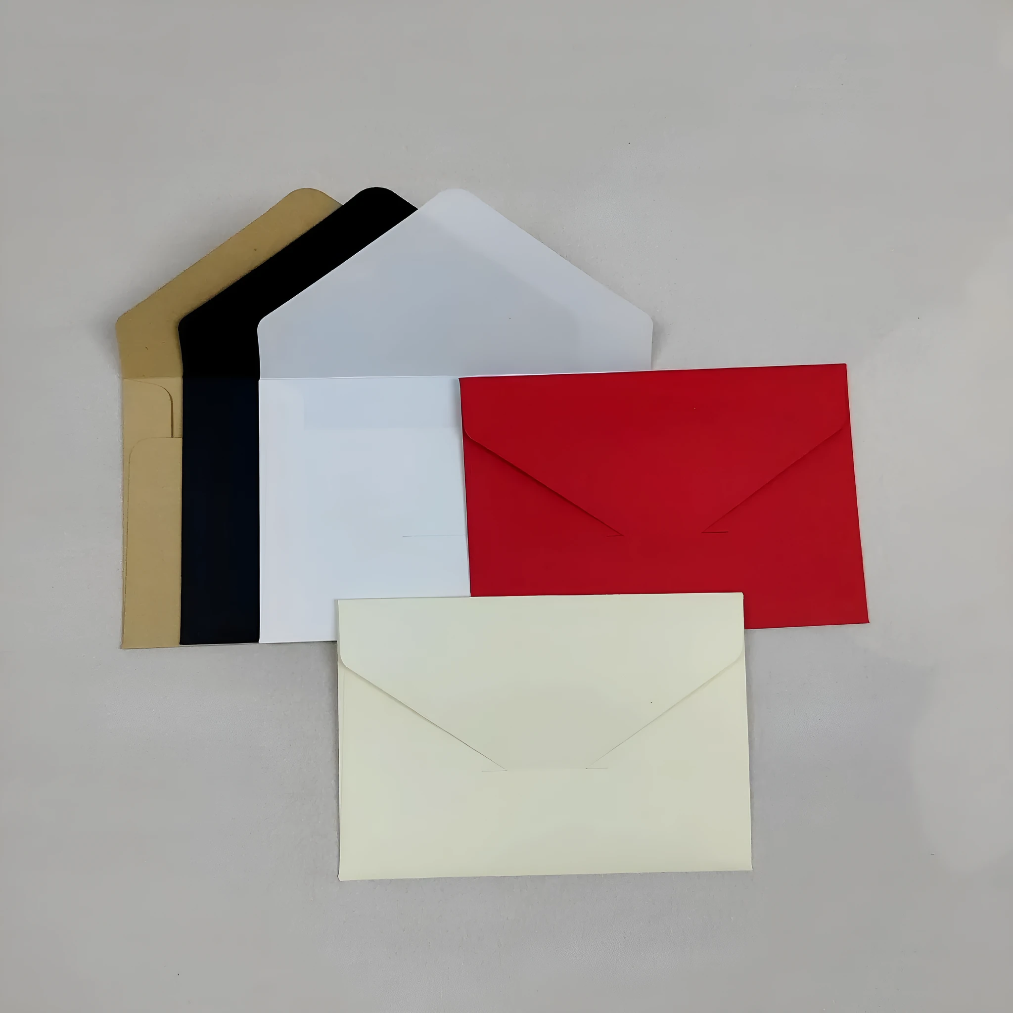 Pack of 100 kraft paper mini envelopes in beige, black, light brown, red, and white