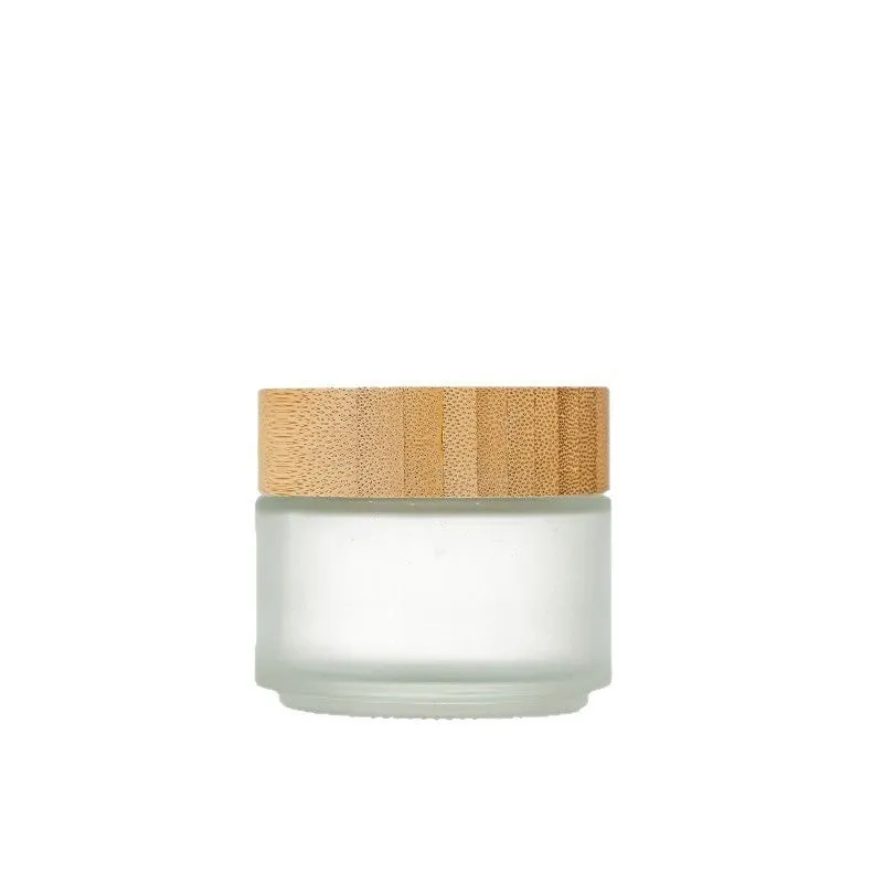 Glass sub-bottle with bamboo wood cover for travel cream in 50g size, transparent finish