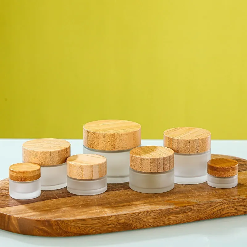 Glass sub-bottle with bamboo wood cover for travel cream in 50g size, transparent finish