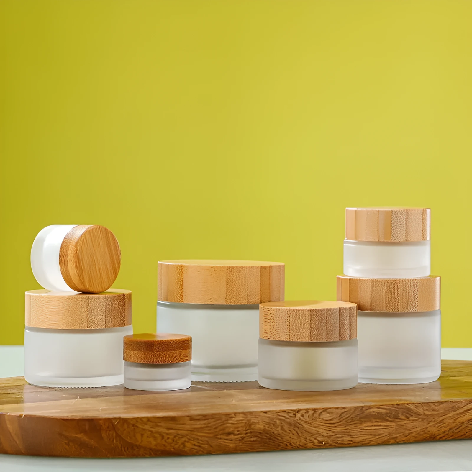 Glass sub-bottle with bamboo wood cover for travel cream in 50g size, transparent finish