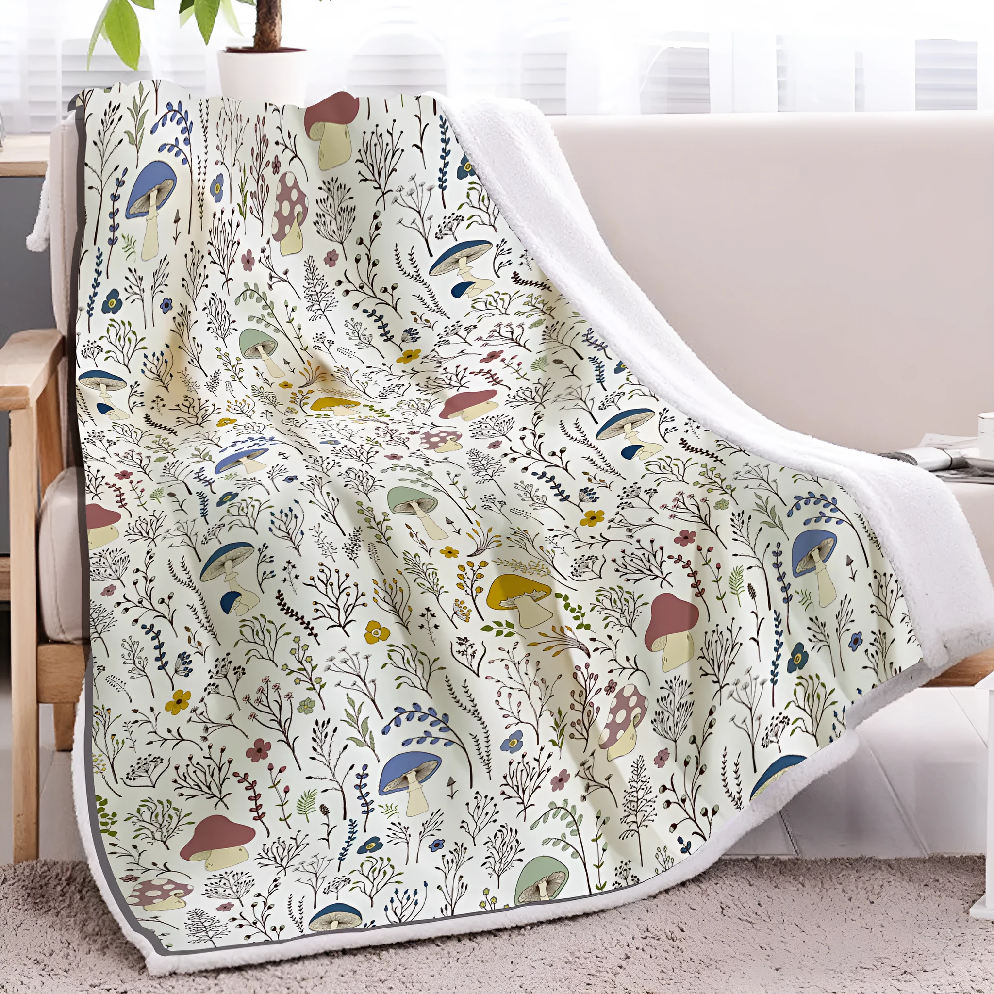 White Sherpa fleece blanket with tree leaf mushroom pattern, sized 130x150cm, on a sofa