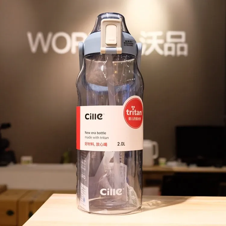 Grey plastic water bottle with black cap and clear straw showing scale markings on the side