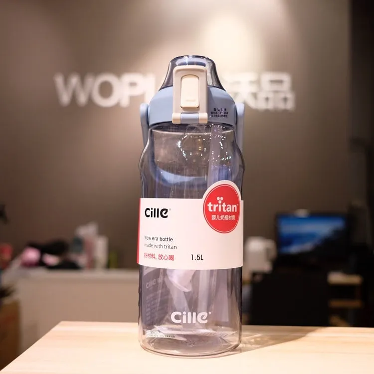 Grey plastic water bottle with black cap and clear straw showing scale markings on the side