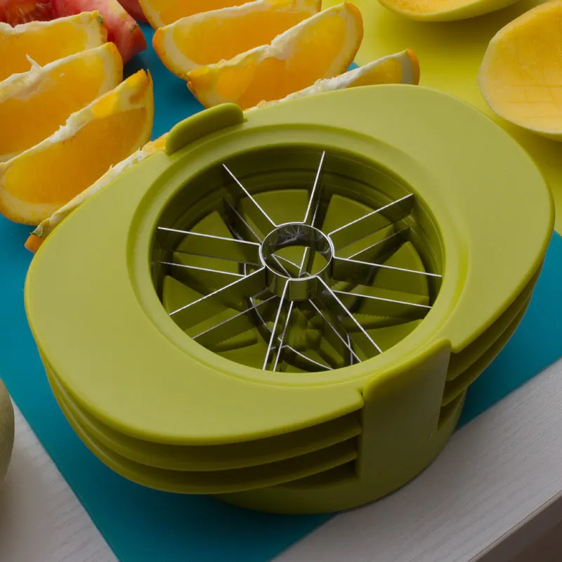 Green fruit slicer with three cutting sections for apple, tomato, and mango on a base