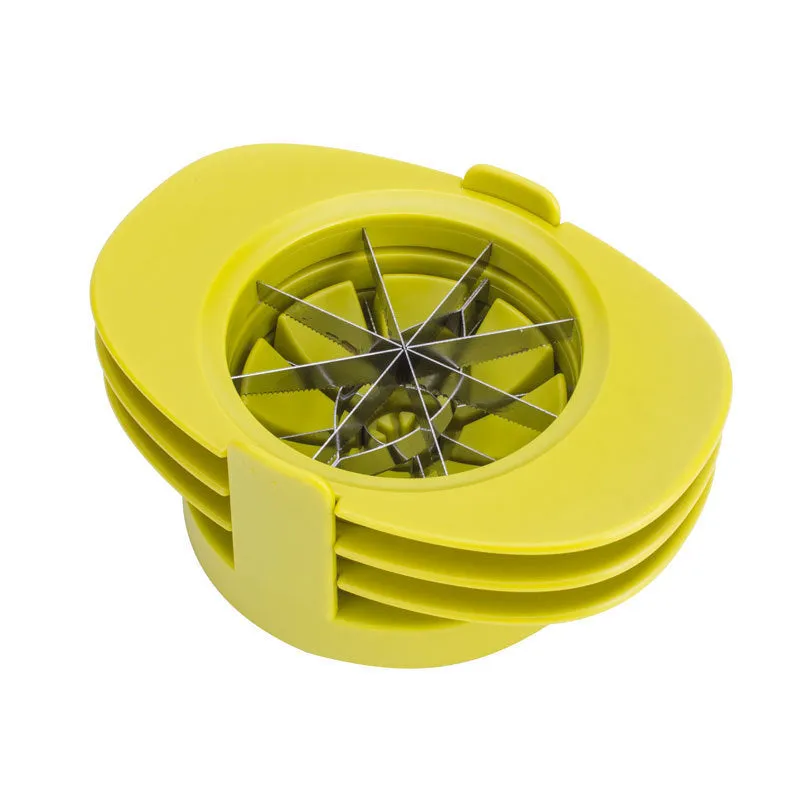 Green fruit slicer with three cutting sections for apple, tomato, and mango on a base