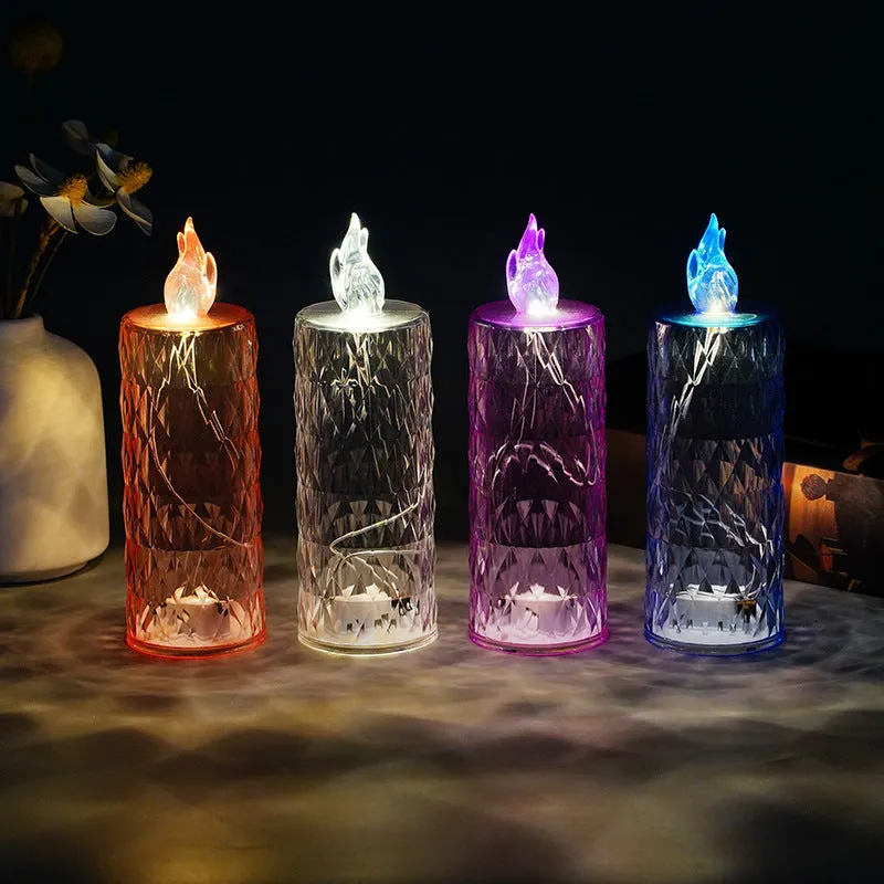 LED electronic candle lamp in ABS plastic with diamond style pattern, transparent colour, shown with base