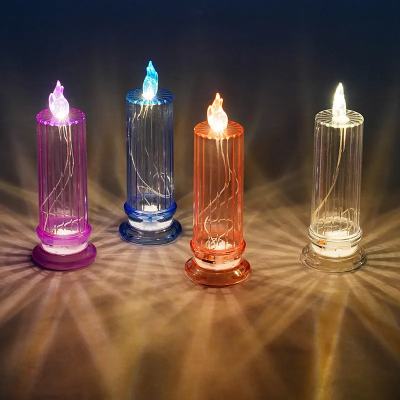 LED electronic candle lamp in ABS plastic with diamond style pattern, transparent colour, shown with base