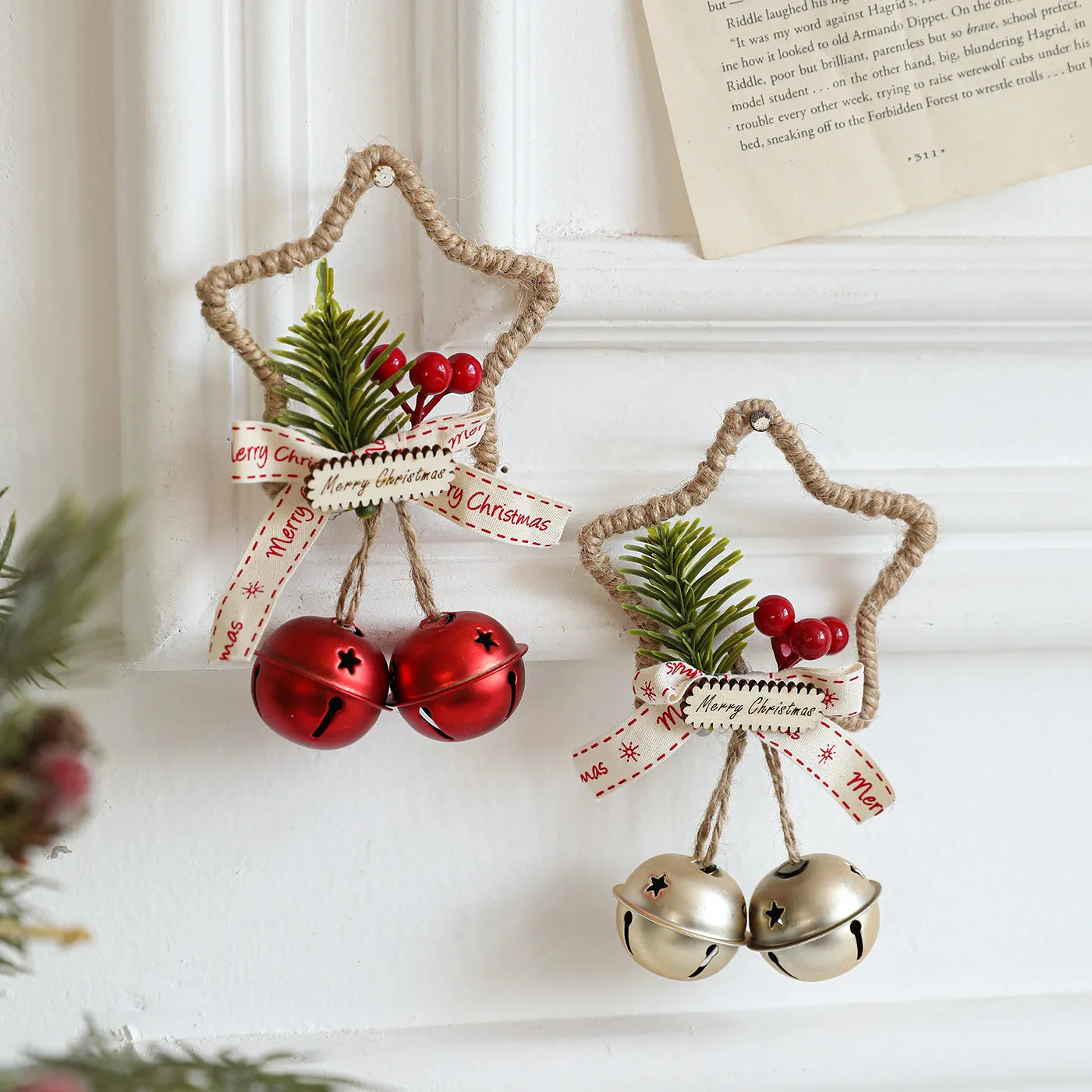Iron Christmas bell ornament in gold on white background