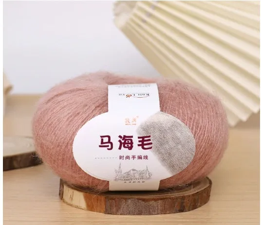 DIY mohair scarf knitting kit showing a ball of wool with 34 colour options including white, grey, pink, and blue.