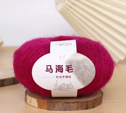 DIY mohair scarf knitting kit showing a ball of wool with 34 colour options including white, grey, pink, and blue.