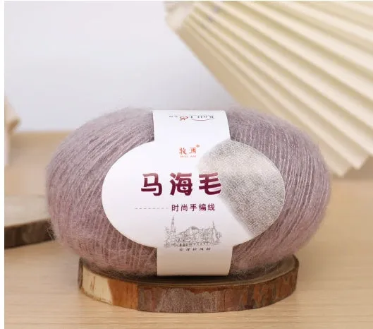 DIY mohair scarf knitting kit showing a ball of wool with 34 colour options including white, grey, pink, and blue.