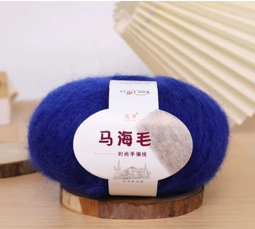 DIY mohair scarf knitting kit showing a ball of wool with 34 colour options including white, grey, pink, and blue.
