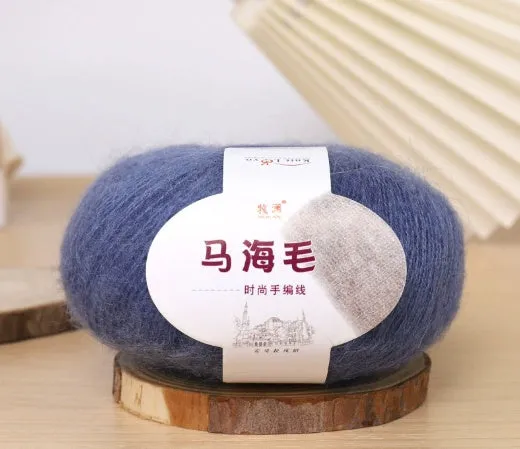 DIY mohair scarf knitting kit showing a ball of wool with 34 colour options including white, grey, pink, and blue.
